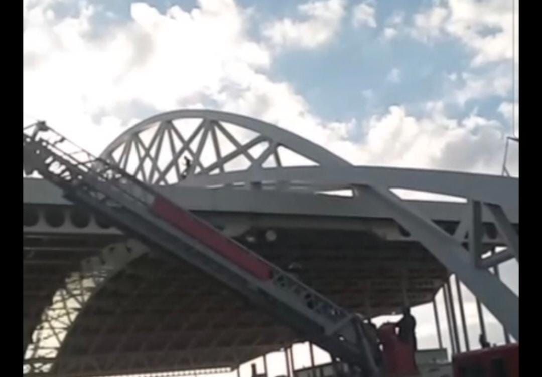 Man attempting to jump from Half-Way-Tree transport centre