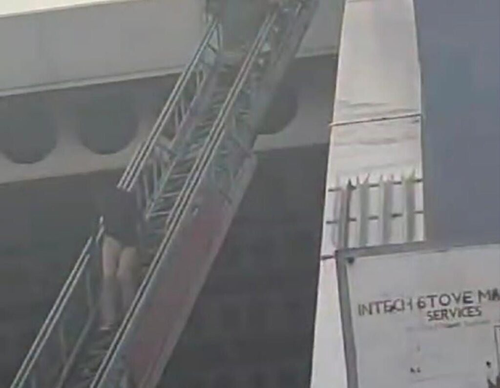 UPDATE: Ex-firefighter climbs down from HWT Transport Centre 